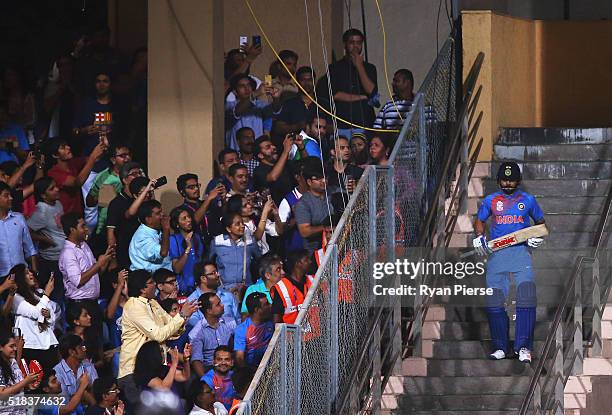 Virat Kohli of India walks out to bat during the ICC World Twenty20 India 2016 Semi Final match between West Indies and India at Wankhede Stadium on...