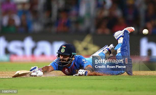 Virat Kohli of India dives to make his ground during the ICC World Twenty20 India 2016 Semi Final match between West Indies and India at Wankhede...