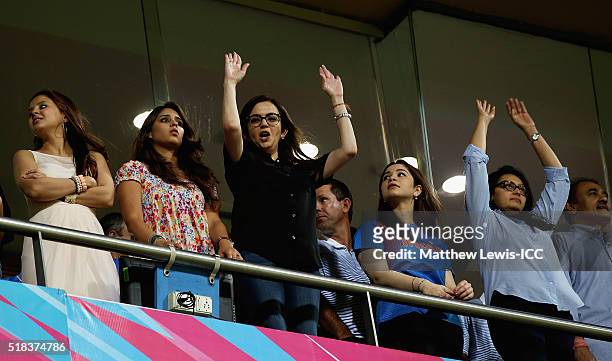 Indian businesswoman Nita Ambani joins in with a 'Mexican wave' during the ICC World Twenty20 India 2016 Semi-Final match between West Indies and...