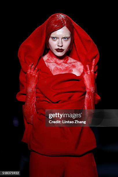 Model showcases designs on the runway at Sheguang Hu Collection during the Mercedes-Benz China Fashion Week Autumn/Winter 2016/2017 at 751D.Park on...