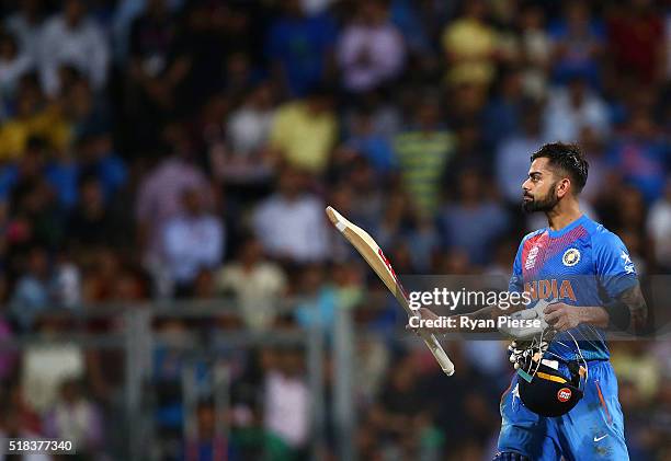 Virat Kohli of India celebrates after reaching his half century during the ICC World Twenty20 India 2016 Semi Final match between West Indies and...