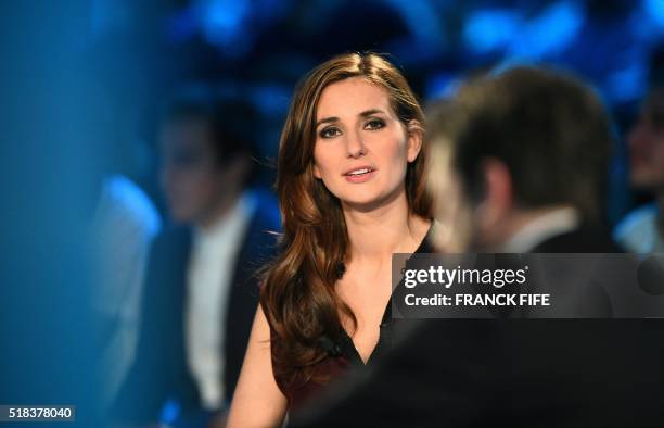 Canal Plus Journalist Marie Portolano gets ready prior to the start of the TV show "Canal Football Club" on March 27, 2016 in Paris.