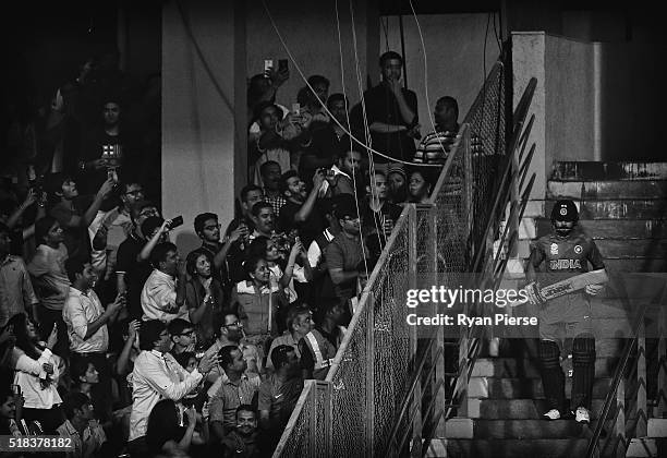 Virat Kohli of India walks out to bat during the ICC World Twenty20 India 2016 Semi Final match between West Indies and India at Wankhede Stadium on...