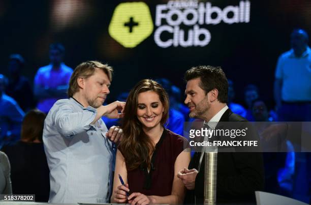 Canal Plus Journalist Marie Portolano gets ready prior to the start of the TV show "Canal Football Club" on March 27, 2016 in Paris.