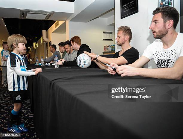 Young supporter meets players seen R-L Paul Dummett, Siem de Jong, Jack Colback, Jamie Sterry, Freddie Woodman and Steven Taylor during the Newcastle...