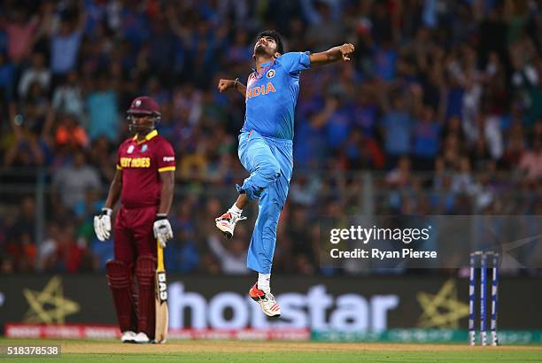 Jasprit Bumrah of India celebrates after taking the wicket of Chris Gayle of the West Indies during the ICC World Twenty20 India 2016 Semi Final...