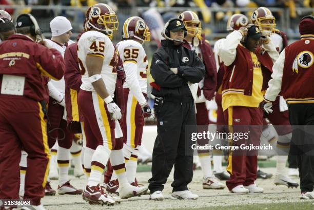 Head coach Joe Gibbs of the Washington Redskins watches his team play the Pittsburgh Steelers at Heinz Field on November 28, 2004 in Pittsburgh,...