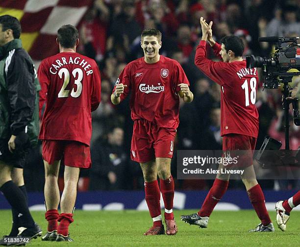 Steven Gerrard of Liverpool celebrates victory over Olympiakos with Jamie Carragher after the Champions League Group A match between Liverpool and...