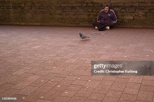 Man begs for loose change in the High Street of Port Talbot on March 31, 2016 in Port Talbot, Wales. Indian owners Tata Steel has put its British...