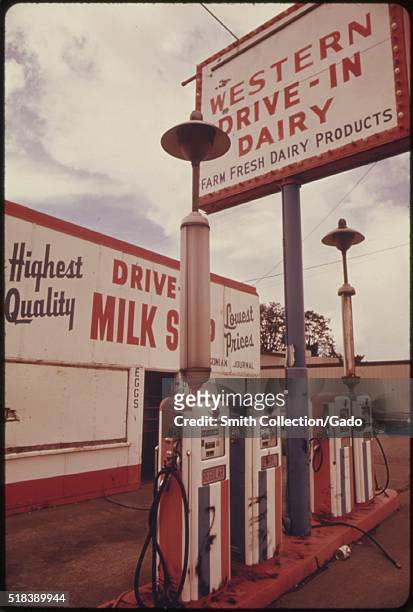 Color photograph of a service station that was forced to close for lack of gasoline during the gas crisis of 1973-1974, four gas pumps can be seen in...