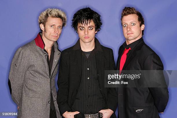 Musicians Green Day poses for a portrait during the 2004 Billboard Music Awards at the MGM Grand Garden Arena on December 8, 2004 in Las Vegas,...