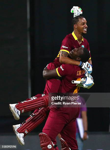 Lendl Simmons and Carlos Brathwaite of the West Indies celebrate victory during the ICC World Twenty20 India 2016 Semi Final match between West...