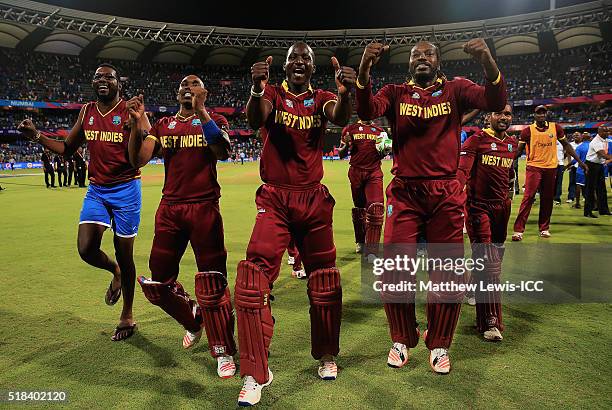 Darren Sammy, Captain of the West Indies celebrates his teams win over India with Sulieman Benn, Dwayne Bravo, Chris Gayle during the ICC World...