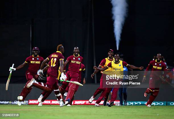 Andre Russell of the West Indies celebrates after hitting the winning runs during the ICC World Twenty20 India 2016 Semi Final match between West...
