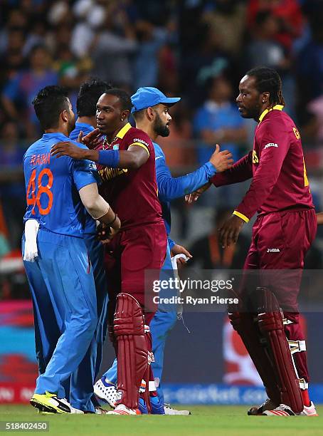 Virat Kohli of India congratulated Chris Gayle of the West Indies after the ICC World Twenty20 India 2016 Semi Final match between West Indies and...