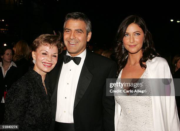 Actor George Clooney with mother Nina Warren and girlfriend model Lisa Snowdon arrive to the Warner Bros. Premiere of the film "Ocean's Twelve" at...