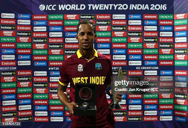 Lendl Simmons of West Indies poses with the man of the match trophy and watch during the ICC World Twenty20 India 2016 Semi-Final match between West...