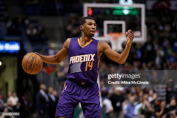 Ronnie Price of the Phoenix Suns looks to pass the basketball during the game against the Milwaukee Bucks at BMO Harris Bradley Center on March 30,...