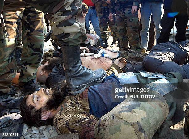 Picture taken 08 November 2004 in Gudermes shows dead bodies of Chechen rebels, which were killed by soldiers of Chechen President Akhmad Kadyrov....