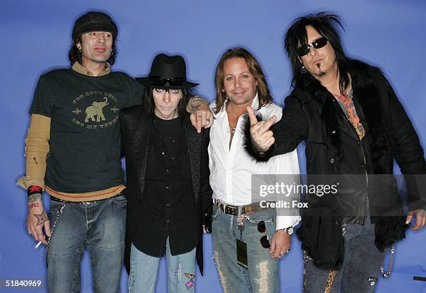 Musicians Tommy Lee, Mick Mars, Vince Neil and Nikki Sixx of Motley Crue poses for a portrait during the 2004 Billboard Music Awards at the MGM Grand...