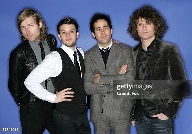 Musicians Mark Stoermer, Brandon Flowers, Ronnie Vannucci and David Keuning of The Killers poses for a portrait during the 2004 Billboard Music...