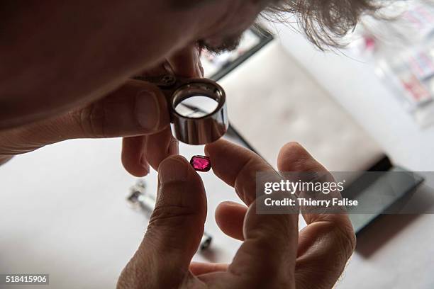 Gemmologist inspects a Mogok ruby.