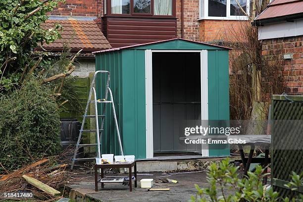 half assembled flat pack shed in garden. - step ladder stock pictures, royalty-free photos & images
