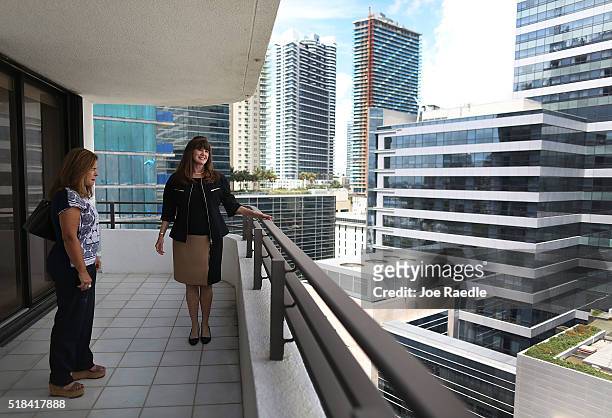 Wanda Bee , Real Estate consultant with Re/Max, shows a condo to prospective buyer, Gioconda Velez-Brooks, at the Brickell East condos on March 31,...