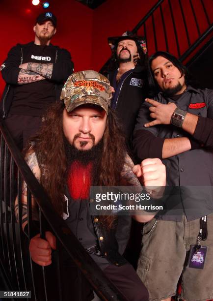 Heavy metal band Damageplan poses for a portrait backstage April 7, 2004 in Chicago, Illinois. Guitarist Dimebag Darrell , real name Darrell Abbott,...