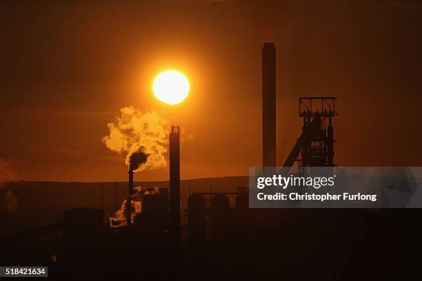 The sun sets behind the Tata Steel plant at Port Talbot on March 31, 2016 in Port Talbot, Wales. Indian owners Tata Steel has put its British...