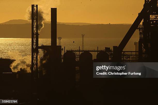 The sun sets behind the Tata Steel plant at Port Talbot on March 31, 2016 in Port Talbot, Wales. Indian owners Tata Steel has put its British...