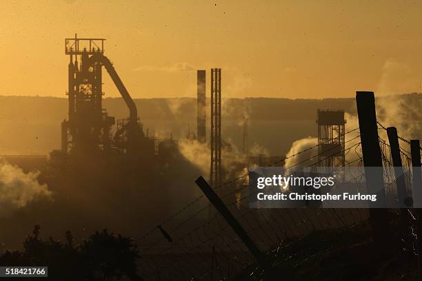 The sun sets behind the Tata Steel plant at Port Talbot on March 31, 2016 in Port Talbot, Wales. Indian owners Tata Steel has put its British...