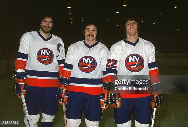 From left, Canadian ice hockey players Clark Gillies, Bryan Trottier, and Mike Bossy of the New York Islanders pose together on the ice in March of...