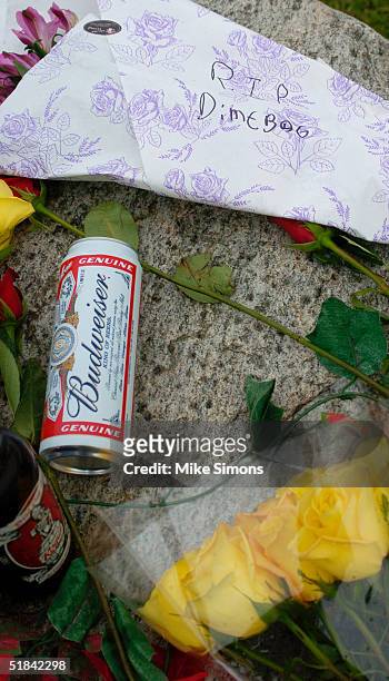 Makeshift memorial rests outside the Alrosa Villa nightclub, the day after a gunman fired on the band Damageplan, December 9, 2004 in Columbus, Ohio....