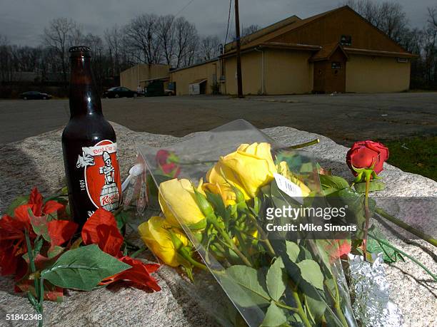Makeshift memorial rests outside of the Alrosa Villa nightclub, the day after a gunman fired on the band Damageplan, December 9, 2004 in Columbus,...