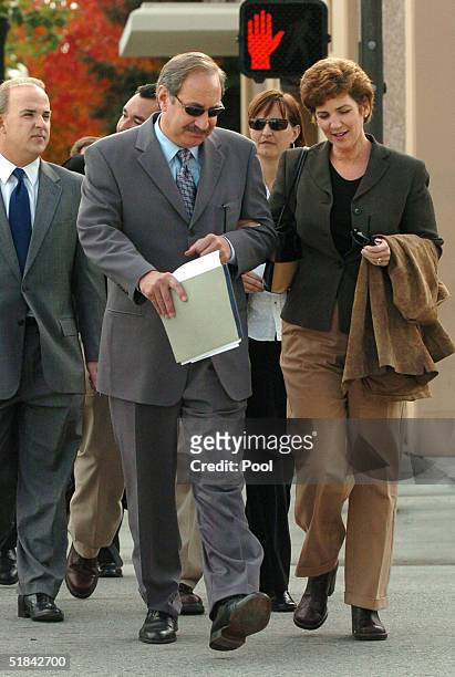 Convicted murderer Scott Peterson's sister, Susan Caudillo walks with defense attorney Mark Geragos and Pat Harris as they return to the San Mateo...