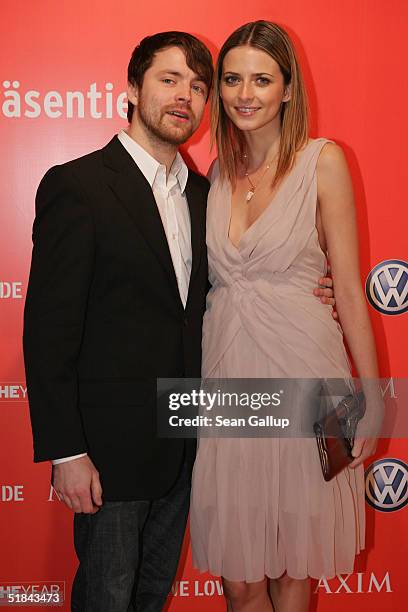 Eva Padberg and friend Niklas Worgt arrive at Maxim's "Woman of the Year" Award at the Axel Springer building on December 9, 2004 in Berlin, Germany.