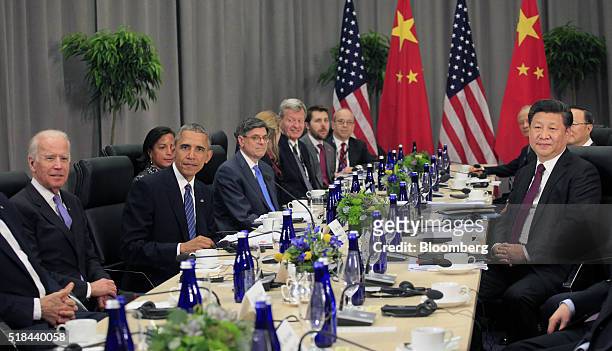 Vice President Joseph "Joe" Biden, left, and U.S. President Barack Obama, third left, sit during a bilateral meeting with Xi Jinping, China's...