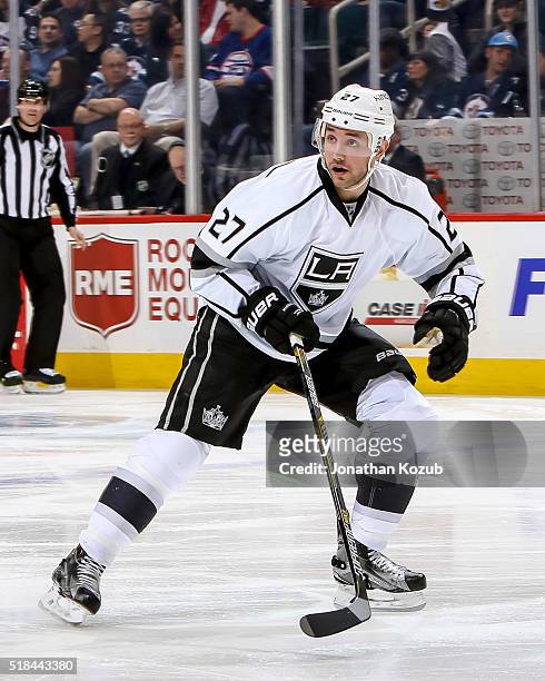 Alec Martinez of the Los Angeles Kings keeps an eye on the play during third period action against the Winnipeg Jets at the MTS Centre on March 24,...