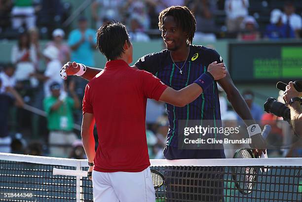 Kei Nishikori of Japan shakes hands at the net after his three set victory against Gael Monfils of France in their quarter final match during the...