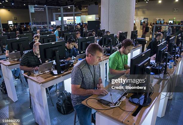 Attendees work in the coding competition booth at the Microsoft Developers Build Conference in San Francisco, California, U.S., on Thursday, March...