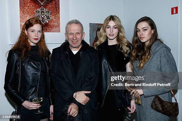 Stylist Jean-Paul Gaultier standing between Models attend the 'Guy Bourdin - Portraits' - Exhibition Opening and Cocktail at Studio des Acacias on...