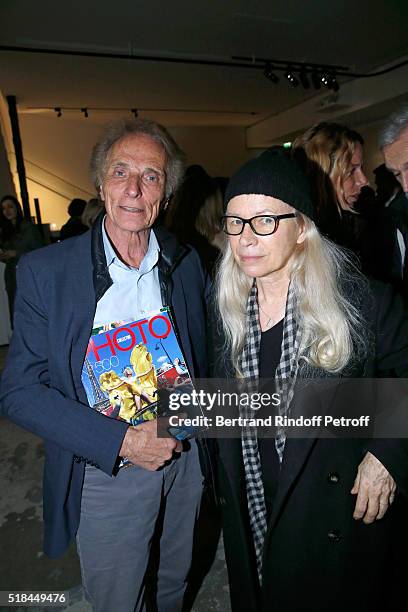 Managing editor of the magazine Photo Eric Colmet-Daage and photographer Dominique Issermann attend the 'Guy Bourdin - Portraits' - Exhibition...