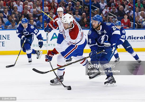 Ryan Callahan of the Tampa Bay Lightning disrupts the shot of Stefan Matteau of the Montreal Canadiens during the second period at the Amalie Arena...