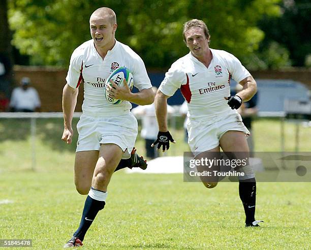 Mathew Tait of England runs with the ball during the match between Ireland and England in the IRB Sevens at Outeniqua Park on December 10, 2004 in...