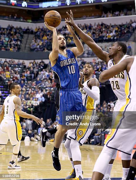 Evan Fournier of the Orlando Magic shoots the ball during the game against the Indiana Pacers at Bankers Life Fieldhouse on March 31, 2016 in...