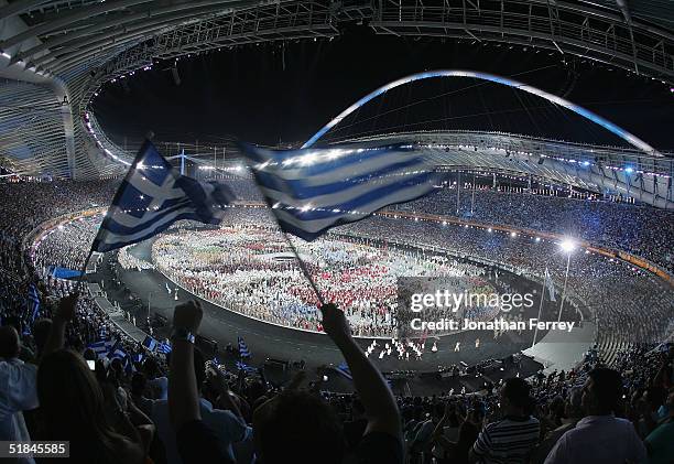 Greek flag is seen during the opening ceremony of the Athens 2004 Summer Olympic Games on August 13, 2004 at the Sports Complex Olympic Stadium in...