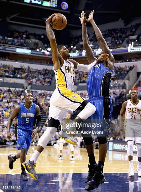 Paul George of the Indiana Pacers shoots the ball during the game against the Orlando Magic at Bankers Life Fieldhouse on March 31, 2016 in...