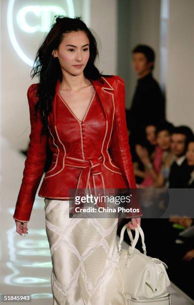 Hong Kong Star Cecilia Cheung walks the runway at the launch show of Christian Dior spring and summer new series on December 9, 2004 in Shanghai,...