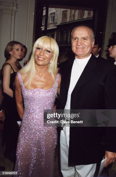 Fashion designer Gianni Versace and sister Donatella Versace attend an Elton John party on June 11, 1995 in London, England.